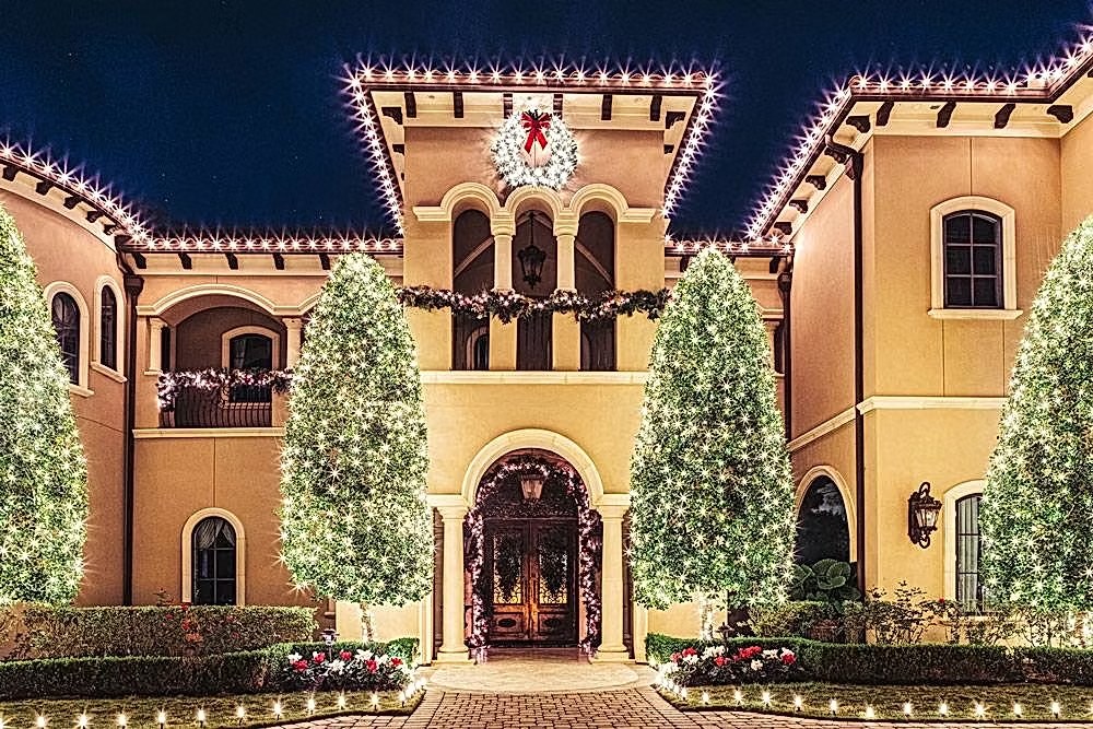 Warm white permanent roofline lighting with lit trees, Orlando FL